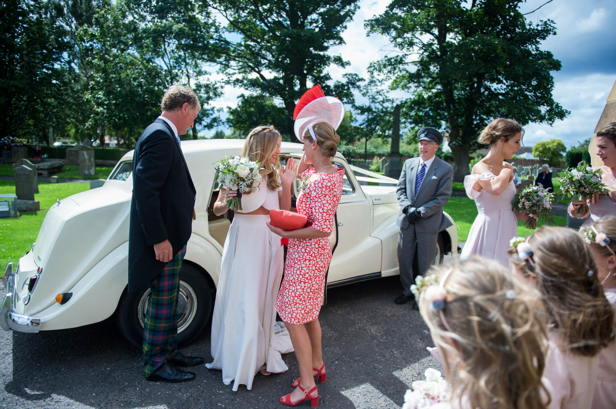 bride arriving at aberlady church for her wedding before the reception at gosford house by especially amy wedding photography